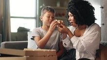 Portrait Of Adorable Little Boy Child Kid And His Young Mother Mom Eating Pizza With Great Pleasure And Enjoying Beautiful Day Together At Home Happy Childhood And Cute Family Concept