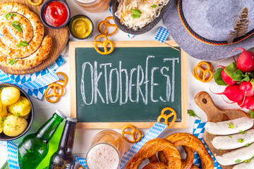 Wall Mural -  Oktoberfest munich traditional festival menu foods - bavarian sausages, pretzels, potato, sauerkraut, beer bottle and mug,  Background flyer for Oktoberfest invitation on old wooden table