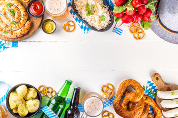 Wall Mural -  Oktoberfest munich traditional festival menu foods - bavarian sausages, pretzels, potato, sauerkraut, beer bottle and mug,  Background flyer for Oktoberfest invitation on old wooden table