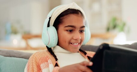 Wall Mural - Home, happy and girl with headphones, tablet or connection with video games, excited or app. Person, kid or child with technology, headset or entertainment with fun, playing online or streaming music