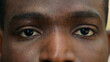 © Yuliia - Close up cropped view detail ad male African American ethnic dark eyes close open blink ophthalmology eyesight see look vision sight eye problem strain ill sick facial expression looking laser surgery