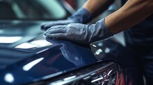 The Man Holds The Microfiber In Hand And Polishes The Car