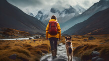 Back View Of Woman Tourist In Yellow Jacket With Red Backpack Walking In Mountains With Ginger Dog In Autumn Hiking And Traveling With Dog 