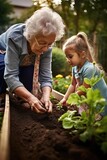 Fototapeta Miasta - shot of a senior woman bonding with her granddaughter while they garden together outside