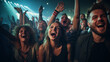 © Keitma - Front row of a concert with a group of excited music fans looking into the camera singing and dancing