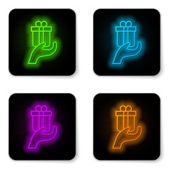 Canvas Print - Glowing neon line Give gift icon isolated on white background. Gift in hand. The concept of giving and receiving a gift. Black square button. Vector