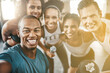 © Chanel Mentoor/peopleimages.com - Portrait, happy gym selfie and friends training for power, workout and healthy exercise together. Face of diversity fitness group, men and women with smile for photograph, pride and sports community