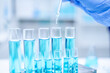 © Irin - Close up scientist use dropper with blue liquid dripping with precision, substance holds the key to discovery in biology, medicine, and biotechnology, research and analysis through experiment analysis