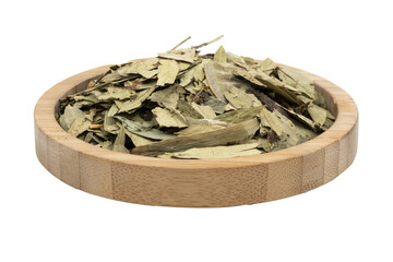 dried senna leaves in a wooden bowl