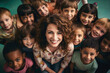 A group portrait of a teacher and her diverse class of elementary school students
