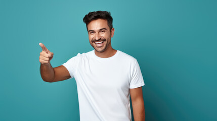 Wall Mural - Middle aged man wearing cwhite T-shirt pointing with hand and finger to the side looking at the camera.