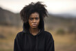 Sadness African Woman In Black Sweatshirt On Nature Landscape Background. Сoncept Sadness, African Woman, Black Sweatshirt, Nature Landscape
