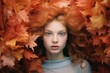 Portrait of a delicate young girl in the autumn colorful leaves. Golden autumn concept.