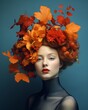 Abstract portrait of abeautiful woman with a wreath of colorful autumn leaves anf flowers. Autumn flower concept.