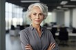 © Ai Studio - Beautiful Middle Aged Woman Standing in the Office. Woman Looking at Camera. Generative AI.