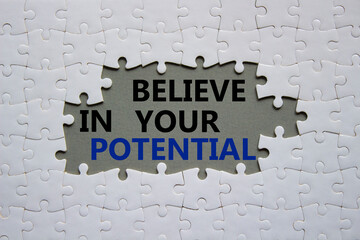 Potential symbol. Concept word Believe in your Potential on white puzzle. Beautiful grey background. Business and Believe in your Potential concept. Copy space