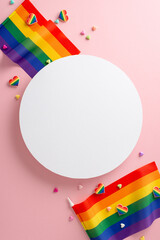 Wall Mural - In honor of LGBTQ+ Pride Month this July. Exquisite top-down vertical photo arrangement of LGBTQ+ flags and symbols on serene pastel pink backdrop. Ideal for promotional content or textual additions