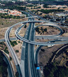 Aerial drone view of a large highway freeway interescting junction with on ramps and off ramps