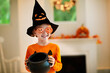 © famveldman - Kids trick or treat. Halloween fun for children.