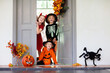 © famveldman - Kids trick or treat. Halloween fun for children.