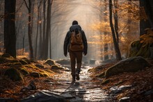 Man Hiking On A Trail Covered In A Blanket Of Fallen Leaves - Autumn Adventure - AI Generated