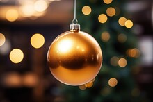 Golden Christmas Ball On Christmas Tree Background And Bokeh
