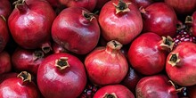 Pile Of Pomegranates Sold At Fruit Market, Food Background