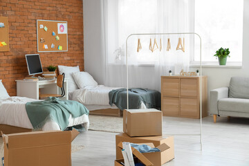 Cardboard boxes in dorm room on moving day