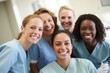 © Anne Schaum - Portrait of group of smiling medical workers in the operating room at hospital
