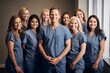 © Anne Schaum - Portrait of a group of smiling medical workers standing together in a hospital
