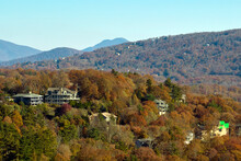 View From Above Of Expensive Residential Houses High On Hill Top Between Yellow Fall Trees In Suburban Area In North Carolina. American Dream Homes As Example Of Real Estate Development In US Suburbs