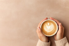 Close Up Of Woman In A Cosy Warm Sweater Holding A Cup Of Coffee With Latte Art Flat Lay With Copy Space