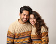 Leinwandbild Motiv Happy Indian couple in winter wear or sweater