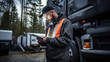 © PaulShlykov - Serviceman with digital tablet on the background of the truck in the garage. Pretrip technical inspection, checklist