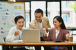 © Prathankarnpap - Overjoyed business team excited by good news online on laptop, celebrating project success