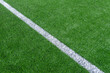 © Augustas Cetkauskas - Green synthetic grass sports field with white line shot from above. Soccer, hurling, lacrosse, rugby, football, baseball sport concept