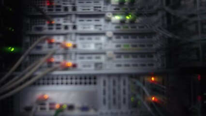 Wall Mural - blurred blinking colorful lights server rack blurred server telecommunications equipment.