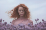 Fototapeta Lawenda - A woman with red hair, wearing a purple dress, immersed in the freedom of a vibrant meadow.
