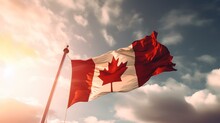 Canadian Flag Waving Against Blue Sky