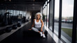 © IBEX.Media - Wide shot of mature fitness woman in white posing in fitness gym , Generative AI illustration