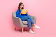 © deagreez - Full size portrait of gorgeous intelligent girl sit comfort chair read book empty space isolated on pink color background