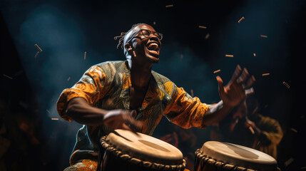 African man plays the drumming drum in national dress.