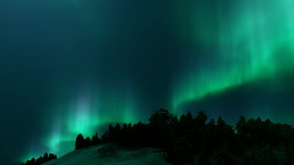 Wall Mural - a beautiful green and red aurora dancing over the hills.