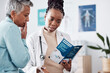 © Talia Mdlungu/peopleimages.com - Brochure, consulting or doctor talking to patient for life insurance or healthcare services or medical data. Medicine, nurse helping or mature woman learning info on pamphlet in hospital for advice