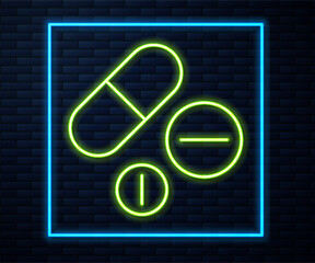 Canvas Print - Glowing neon line Medicine pill or tablet icon isolated on brick wall background. Capsule pill and drug sign. Pharmacy design. Vector