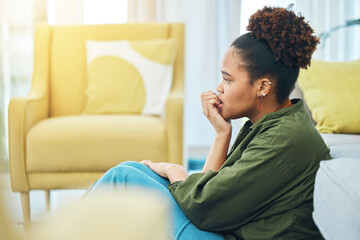 Home, anxiety and woman with fear, depression and scared with mental health, biting nails and mistake in a lounge. Person on the floor, lady or girl confused, fail and waiting for feedback or results