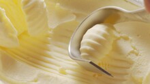 Butter Is Scraped Off With A Special Butter Knife From A Pack Of Butter Into A Recognizable Shape.