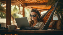 Young Woman Lifestyle Digital Nomad Working On The Laptop Hammock At The Beach Sunset Time