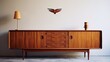 A Danish designed teak wood sideboard from the 1960s, adorned with high quality 1920s lamp, displayed in the living room.