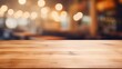 © Lasvu - Blurred coffee shop and restaurant interior background with empty wooden table. Use for products display or montage.